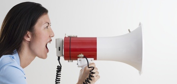 Why You Might Be Turning Off Customers Unintentionally Woman yelling in megaphone