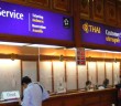 People waiting at customer service counter