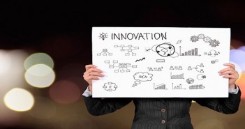 businessman holding an innovation graph